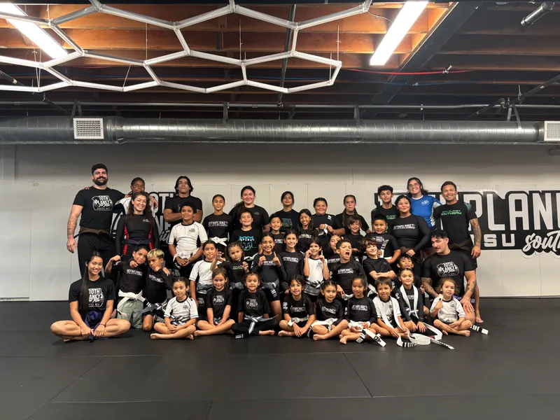 Head coach PJ Barch competing in a no-gi grappling match
