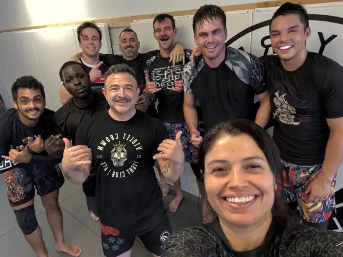 Students training jiu jitsu on the mats at Analog Jiu Jitsu