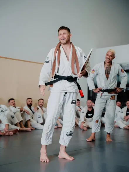 Jules, Judo Black Belt · BJJ Black Belt