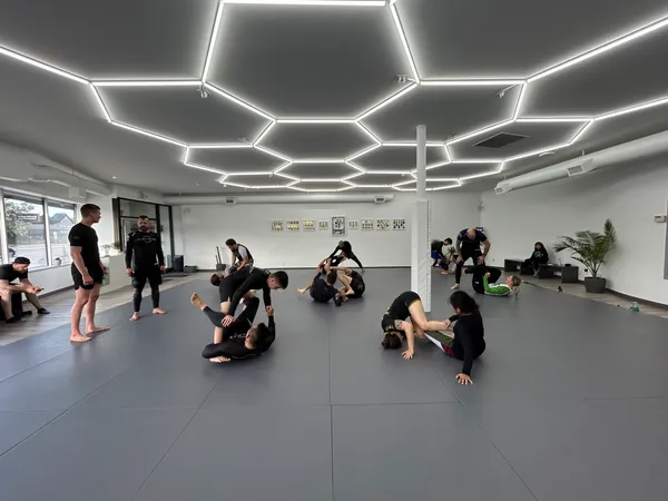 Members rolling during a Balance Jiu-Jitsu class