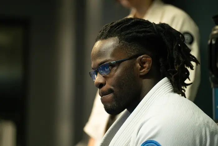 Coach focused on what students are working on in class at Bones Jiu Jitsu