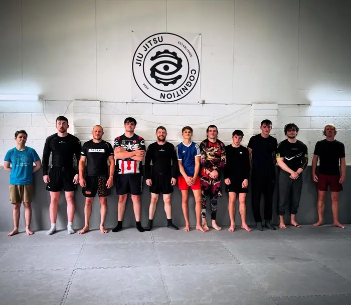 Adults and juniors lined up after a Cognition Jiu Jitsu grappling session