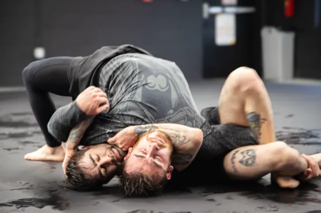 Two athletes battling for position during live rounds