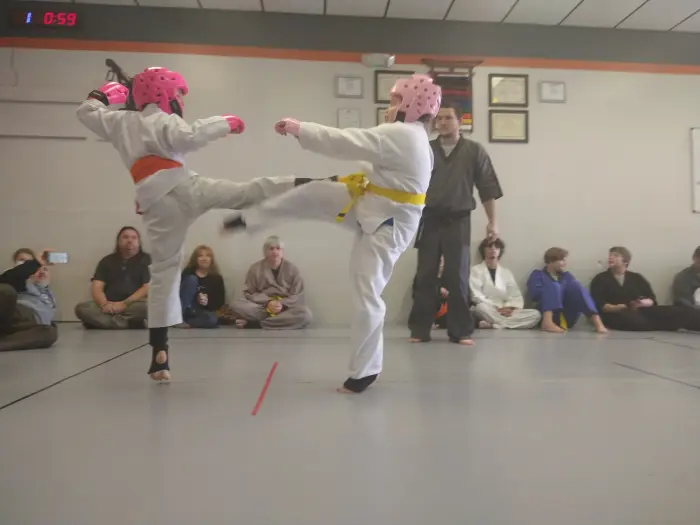 Young students sparring during a kids martial arts class
