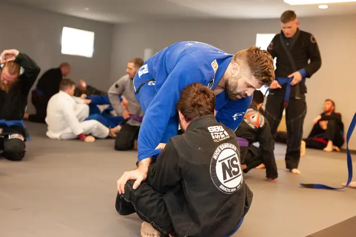 Adults training grappling at HeadNod