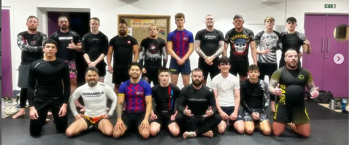 The Hook Grappling team and students together on the mats