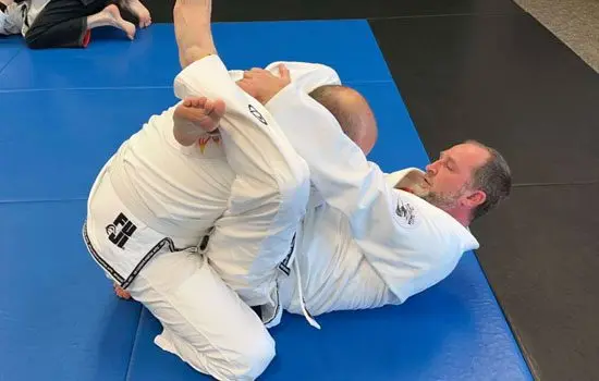 Adult Brazilian Jiu Jitsu rolling at No Illusions