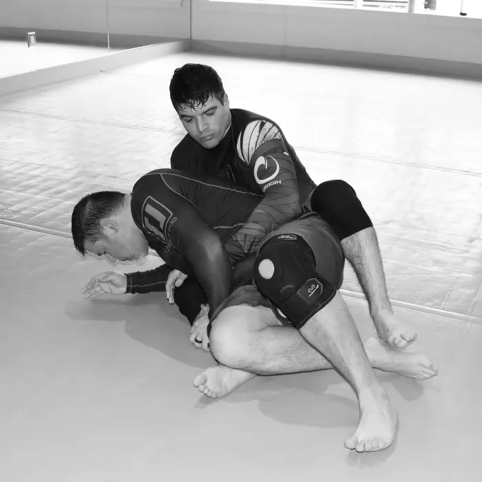 Coach Nick taking the back during live no-gi training
