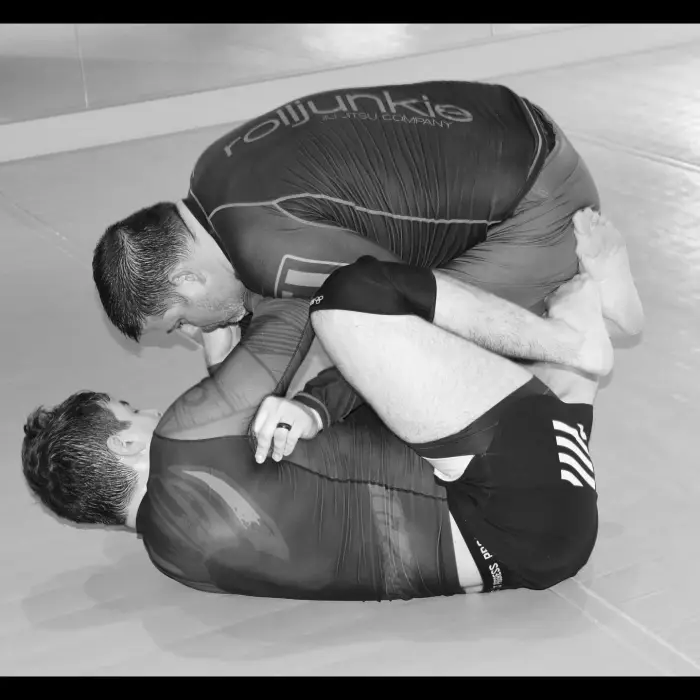 Coach Nick passing guard while rolling no-gi