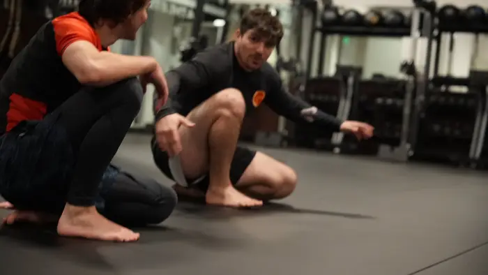 Members rolling during class at On Top Jiujitsu