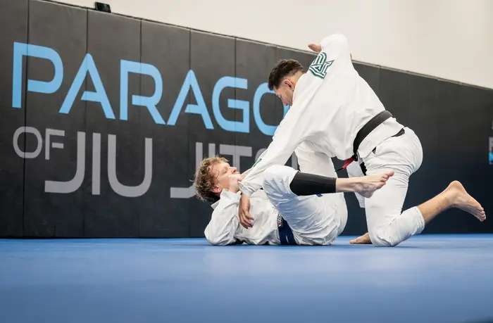 Students rolling during a BJJ session at Paragon