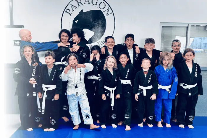 Kids and teens jiu-jitsu class in their gis on the mats at Paragon Simi Valley