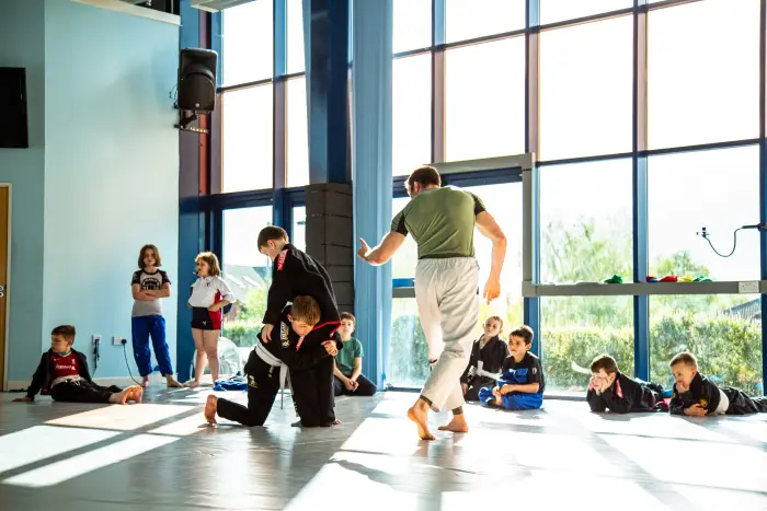 Coaching a technique during a BJJ class at Peak Jiu Jitsu