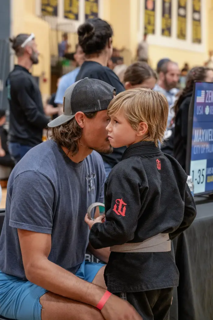 Coach and young student at a Revive Jiu Jitsu competition