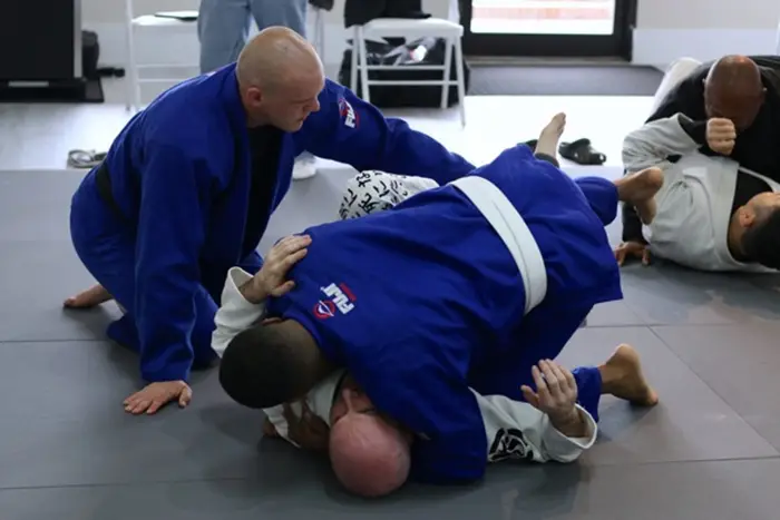 Members drilling Brazilian Jiu Jitsu in class