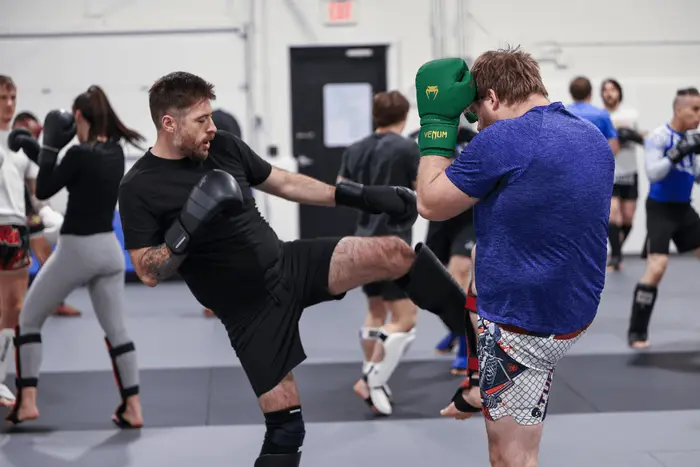 Students grappling during an all-levels class