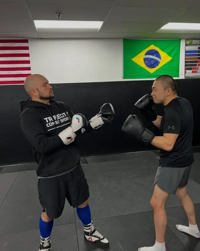 Women rolling during a Brazilian Jiu-Jitsu class at Triple City Combat Sports
