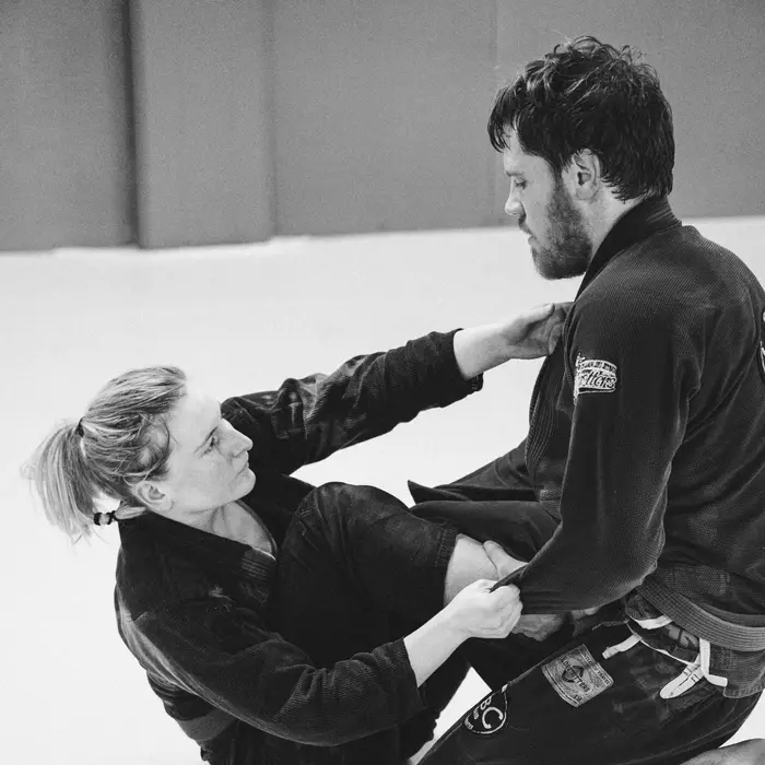 Two BJJ students grappling in the gi during a Brazilian Jiu-Jitsu class at VBC