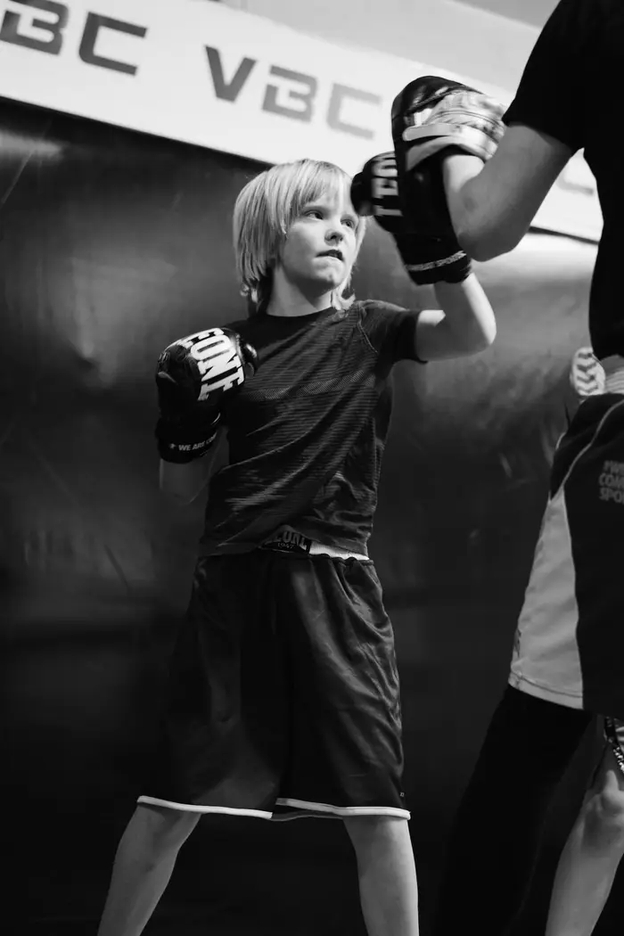 A youth boxer in a fighting stance during a VBC boxing class